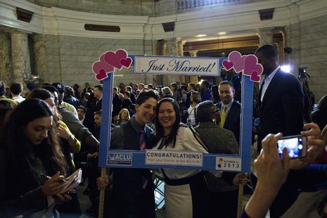 Gabriela Celeiro (C, right) and her partner Liz Salermo pose for a picture after their marriage ceremony at City Hall in Newark, New Jersey Gabriela Celeiro (C, right) and her partner Liz Salermo pose for a picture after their marriage ceremony at City Hall in Newark, New Jersey