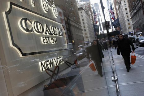 People walk past a Coach store on Madison Avenue in New York, January 23, 2013. REUTERS/Carlo Allegri People walk past a Coach store on Madison Avenue in New York, January 23, 2013. REUTERS/Carlo Allegri