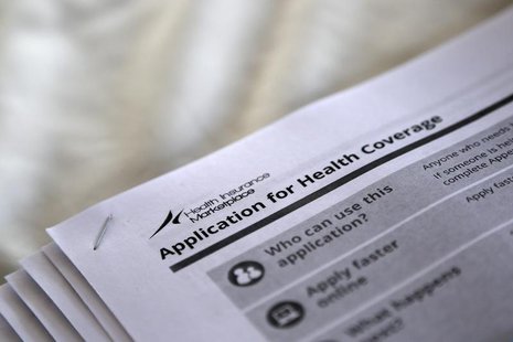 The federal government forms for applying for health coverage are seen at a rally held by supporters of the Affordable Care Act, widely refe The federal government forms for applying for health coverage are seen at a rally held by supporters of the Affordable Care Act, widely refe