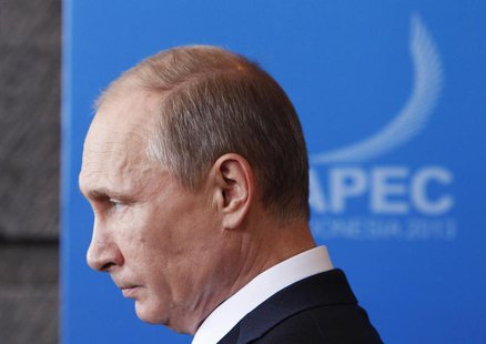 Russia's President Vladimir Putin leaves the Asia-Pacific Economic Cooperation (APEC) Leaders Press Conference and Joint Declaration in Nusa Russia's President Vladimir Putin leaves the Asia-Pacific Economic Cooperation (APEC) Leaders Press Conference and Joint Declaration in Nusa