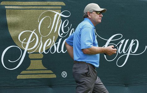 International Team captain Nick Price of Zimbabwe carries a two-way radio during the second practice round for the 2013 Presidents Cup golf International Team captain Nick Price of Zimbabwe carries a two-way radio during the second practice round for the 2013 Presidents Cup golf