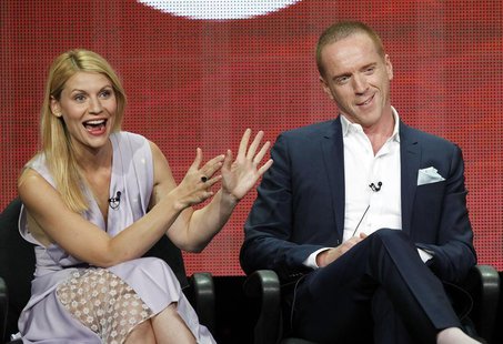 Cast member Claire Danes gestures next to co-star Damian Lewis at a panel for the television series "Homeland" during the Showtime portion o Cast member Claire Danes gestures next to co-star Damian Lewis at a panel for the television series "Homeland" during the Showtime portion o