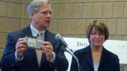 Senator's John Hoeven and Amy Klobuchar with an Event Data Recorder Senator's John Hoeven and Amy Klobuchar with an Event Data Recorder