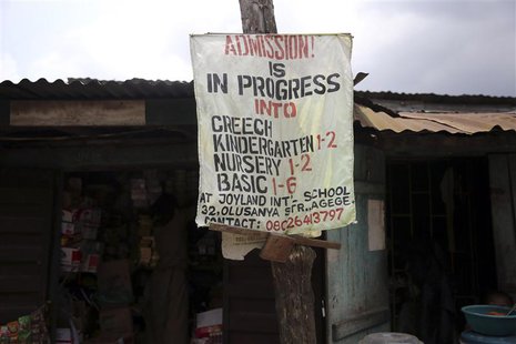 A banner advertising a school is seen on an electricity pole in front of a shop at a foodstuff market in the Agege district of Lagos October A banner advertising a school is seen on an electricity pole in front of a shop at a foodstuff market in the Agege district of Lagos October