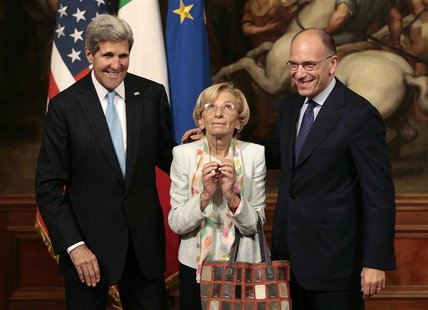 Italy's Prime Minister Enrico Letta (R), U.S. Secretary of State John Kerry (L) and Italy's Foreign Minister Emma Bonino pose for photo duri Italy's Prime Minister Enrico Letta (R), U.S. Secretary of State John Kerry (L) and Italy's Foreign Minister Emma Bonino pose for photo duri