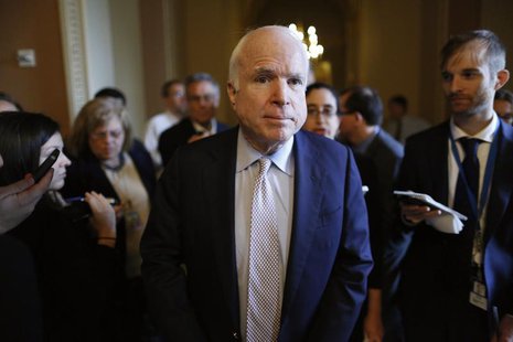 U.S. Senator John McCain (R-AZ) (C) talks to reporters on his way to vote on the Senate floor at the U.S. Capitol in Washington, October 12, U.S. Senator John McCain (R-AZ) (C) talks to reporters on his way to vote on the Senate floor at the U.S. Capitol in Washington, October 12,