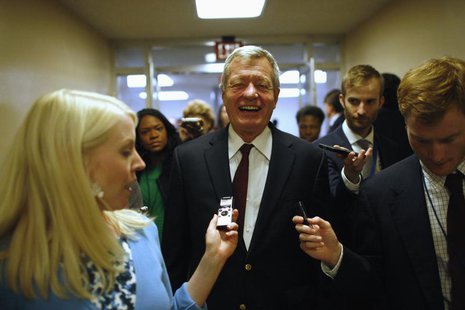 U.S. Senator Max Baucus talks to reporters after the Senate passed a spending bill to avoid a government shutdown, sending the issue back to U.S. Senator Max Baucus talks to reporters after the Senate passed a spending bill to avoid a government shutdown, sending the issue back to