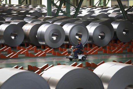 An employee works inside a steel factory in Caofeidian on the northeastern coast of China's Hebei province, October 11, 2013. REUTERS/China An employee works inside a steel factory in Caofeidian on the northeastern coast of China's Hebei province, October 11, 2013. REUTERS/China