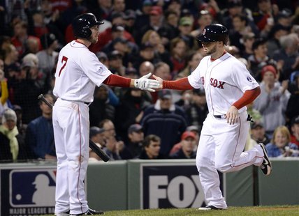 Oct 23, 2013; Boston, MA, USA; Boston Red Sox pinch hitter Daniel Nava (right) is congratulated by shortstop Stephen Drew (not pictured) aft Oct 23, 2013; Boston, MA, USA; Boston Red Sox pinch hitter Daniel Nava (right) is congratulated by shortstop Stephen Drew (not pictured) aft