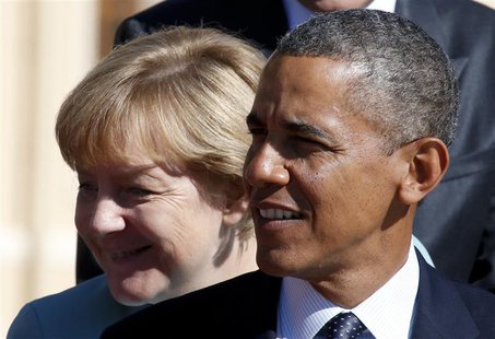 U.S. President Barack Obama (R) and German Chancellor Angela Merkel arrive for the family picture event during the G20 summit in St.Petersbu U.S. President Barack Obama (R) and German Chancellor Angela Merkel arrive for the family picture event during the G20 summit in St.Petersbu