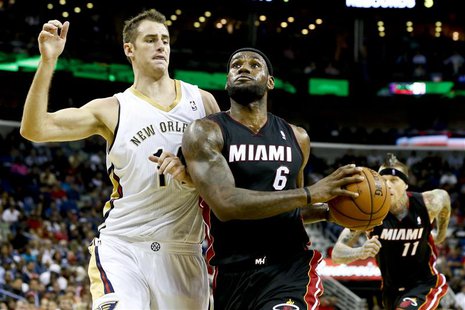 Oct 23, 2013; New Orleans, LA, USA; Miami Heat small forward LeBron James (6) drives past New Orleans Pelicans power forward Jason Smith (14 Oct 23, 2013; New Orleans, LA, USA; Miami Heat small forward LeBron James (6) drives past New Orleans Pelicans power forward Jason Smith (14