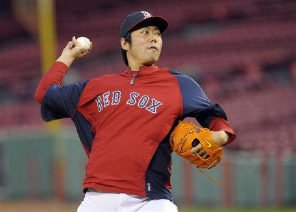 Oct 22, 2013; Boston, MA, USA; Boston Red Sox relief pitcher Koji Uehara (19) throws a pitch during workouts the day before game one of the Oct 22, 2013; Boston, MA, USA; Boston Red Sox relief pitcher Koji Uehara (19) throws a pitch during workouts the day before game one of the