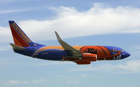 A Southwest Airlines passenger aircraft painted with a new NBA logo theme arrives at Love Field airport for a news conference in Dallas, Tex A Southwest Airlines passenger aircraft painted with a new NBA logo theme arrives at Love Field airport for a news conference in Dallas, Tex