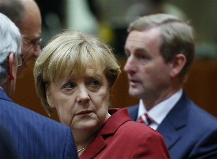 Germany's Chancellor Angela Merkel (L) and Ireland's Prime Minister Enda Kenny (R) attend a European Union leaders summit in Brussels Octobe Germany's Chancellor Angela Merkel (L) and Ireland's Prime Minister Enda Kenny (R) attend a European Union leaders summit in Brussels Octobe