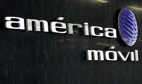 The logo of America Movil is seen on the wall of the reception area in the company's new corporate offices in Mexico City February 8, 2011. The logo of America Movil is seen on the wall of the reception area in the company's new corporate offices in Mexico City February 8, 2011.
