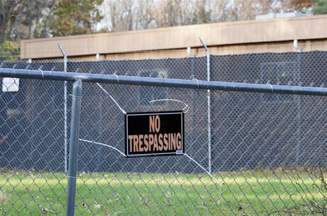 A security fence surrounds Sandy Hook Elementary School in Newtown, Connecticut October 24, 2013. REUTERS/Michelle McLoughlin A security fence surrounds Sandy Hook Elementary School in Newtown, Connecticut October 24, 2013. REUTERS/Michelle McLoughlin