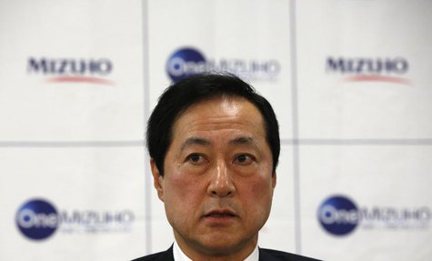 Mizuho Financial Group President and CEO Yasuhiro Sato speaks during a news conference on the merging of Mizuho Bank and Mizuho Corporate Ba Mizuho Financial Group President and CEO Yasuhiro Sato speaks during a news conference on the merging of Mizuho Bank and Mizuho Corporate Ba