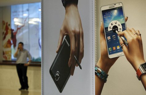 A man talks on his mobile phone near advertisements promoting the Samsung Electronics' Galaxy Note 3 at the company's headquarters in Seoul A man talks on his mobile phone near advertisements promoting the Samsung Electronics' Galaxy Note 3 at the company's headquarters in Seoul