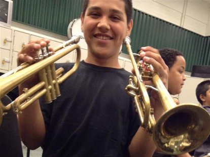 Andy Lopez Cruz holds trumpets in this undated family photo released to Reuters on October 24, 2013. REUTERS/Lopez family photo/Handout Andy Lopez Cruz holds trumpets in this undated family photo released to Reuters on October 24, 2013. REUTERS/Lopez family photo/Handout
