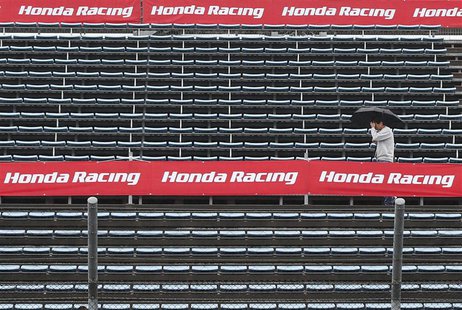 A MotoGP fan walks in the stands at the Twin Ring Motegi circuit ahead of Sunday's Japanese Grand Prix in Motegi, north of Tokyo October 25, A MotoGP fan walks in the stands at the Twin Ring Motegi circuit ahead of Sunday's Japanese Grand Prix in Motegi, north of Tokyo October 25,
