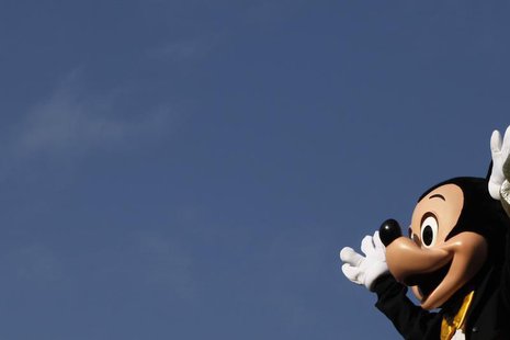 A person dressed as Mickey Mouse waves during a musical parade at Hong Kong Disneyland November 4, 2009. REUTERS/Tyrone Siu A person dressed as Mickey Mouse waves during a musical parade at Hong Kong Disneyland November 4, 2009. REUTERS/Tyrone Siu