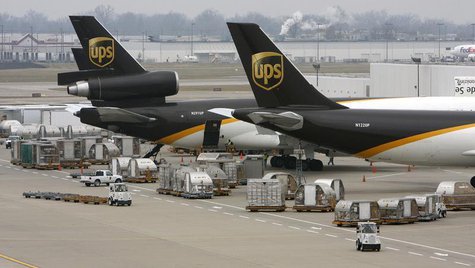 United Parcel Service aircraft are loaded with air containers full of packages bound for their final destination at the UPS Worldport All Po United Parcel Service aircraft are loaded with air containers full of packages bound for their final destination at the UPS Worldport All Po