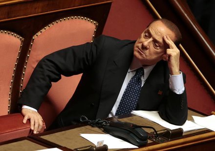 Italian center-right leader Silvio Berlusconi (R) looks on at the Senate in Rome, October 2, 2013. REUTERS/Tony Gentile Italian center-right leader Silvio Berlusconi (R) looks on at the Senate in Rome, October 2, 2013. REUTERS/Tony Gentile