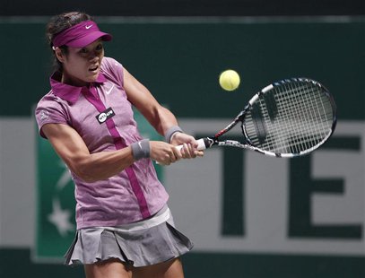 Li Na of China hits a return to Victoria Azarenka of Belarus during their WTA tennis championships match at Sinan Erdem Dome in Istanbul, Oc Li Na of China hits a return to Victoria Azarenka of Belarus during their WTA tennis championships match at Sinan Erdem Dome in Istanbul, Oc