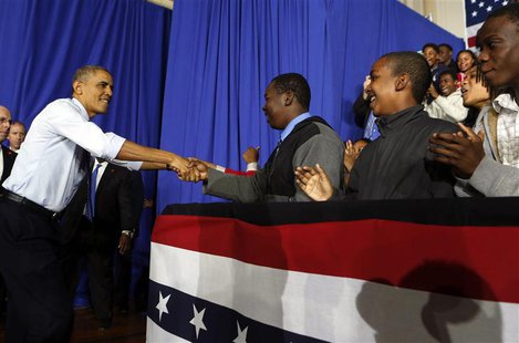 U.S. President Barack Obama shakes hands before he speaks at the Pathways in Technology Early College High School in Brooklyn, October 25, 2 U.S. President Barack Obama shakes hands before he speaks at the Pathways in Technology Early College High School in Brooklyn, October 25, 2