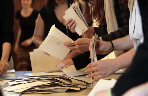 Election committee members collect votes from an emptied ballot box after polling stations closed for the country's early general election i Election committee members collect votes from an emptied ballot box after polling stations closed for the country's early general election i