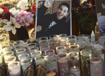 A photo of Andy Lopez Cruz is shown at a makeshift memorial at the site of his death in Santa Rosa, California October 24, 2013. REUTERS/Rob A photo of Andy Lopez Cruz is shown at a makeshift memorial at the site of his death in Santa Rosa, California October 24, 2013. REUTERS/Rob