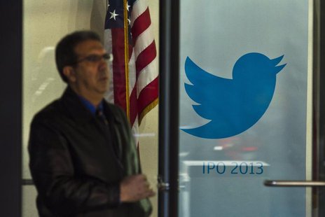A man walks past a Twitter banner while leaving JP Morgan headquarters, before Twitter's IPO in New York October 25, 2013. REUTERS/Eduardo M A man walks past a Twitter banner while leaving JP Morgan headquarters, before Twitter's IPO in New York October 25, 2013. REUTERS/Eduardo M