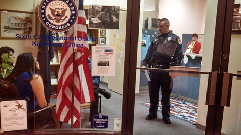 Sit in protestors meet Public Safety officer, While Upton Aide Lynn Turner looks on. Sit in protestors meet Public Safety officer, While Upton Aide Lynn Turner looks on.