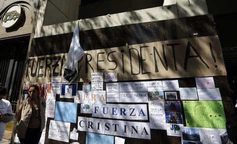 A woman waits next to signs in support of Argentina's President Cristina Fernandez outside the hospital where she had surgery in Buenos Aire A woman waits next to signs in support of Argentina's President Cristina Fernandez outside the hospital where she had surgery in Buenos Aire