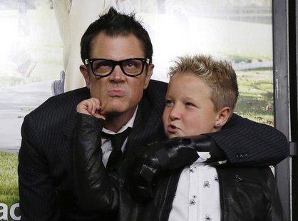 Cast member Johnny Knoxville (L) poses with co-star Jackson Nicoll at the premiere of "Jackass Presents: Bad Grandpa" in Hollywood, Californ Cast member Johnny Knoxville (L) poses with co-star Jackson Nicoll at the premiere of "Jackass Presents: Bad Grandpa" in Hollywood, Californ