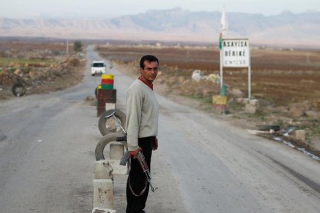 A Syrian Kurd Asaish stands at a security checkpoint at Derik in Al-Hasakah October 31, 2012. REUTERS/Thaier al-Sudani A Syrian Kurd Asaish stands at a security checkpoint at Derik in Al-Hasakah October 31, 2012. REUTERS/Thaier al-Sudani
