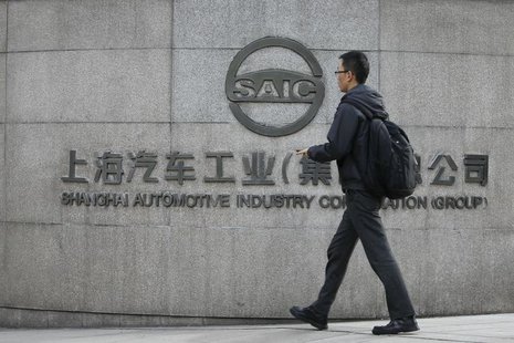 A man walks in front of the gate of Shanghai Automotive Industry Corp. in Shanghai November 18, 2010. REUTERS/Aly Song A man walks in front of the gate of Shanghai Automotive Industry Corp. in Shanghai November 18, 2010. REUTERS/Aly Song