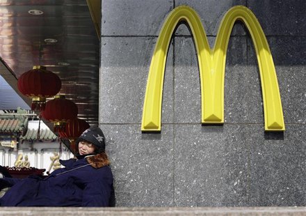 A woman rests outside a McDonald's outlet in Beijing in this February 5, 2009 file photo. REUTERS/Jason Lee/Files A woman rests outside a McDonald's outlet in Beijing in this February 5, 2009 file photo. REUTERS/Jason Lee/Files