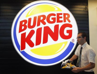An employee prepares a food order on the opening day of the Burger King restaurant at the Marignane airport hall December 22, 2012. REUTERS/ An employee prepares a food order on the opening day of the Burger King restaurant at the Marignane airport hall December 22, 2012. REUTERS/