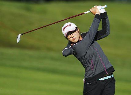 Lydia Ko of New Zealand hits an approach shot onto the 15th hole during the first round of the women's Evian Championship golf tournament in Lydia Ko of New Zealand hits an approach shot onto the 15th hole during the first round of the women's Evian Championship golf tournament in