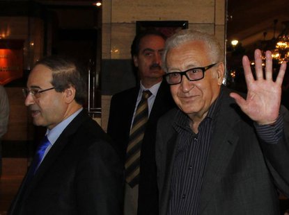 United Nations Peace Envoy for Syria Lakhdar Brahimi (R) waves to journalists during his arrival at a hotel in Damascus October 28, 2013. Se United Nations Peace Envoy for Syria Lakhdar Brahimi (R) waves to journalists during his arrival at a hotel in Damascus October 28, 2013. Se