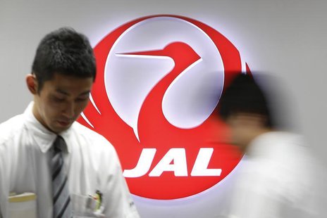 Employees of Japan Airlines (JAL) work in front of the company logo at Haneda airport in Tokyo April 28, 2013. REUTERS/Yuya Shino Employees of Japan Airlines (JAL) work in front of the company logo at Haneda airport in Tokyo April 28, 2013. REUTERS/Yuya Shino