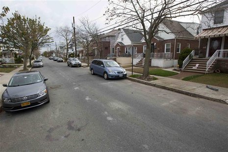 In this picture taken October 23, 2013 a street photographed almost a year ago covered with debris thrown in the street after Superstorm San In this picture taken October 23, 2013 a street photographed almost a year ago covered with debris thrown in the street after Superstorm San