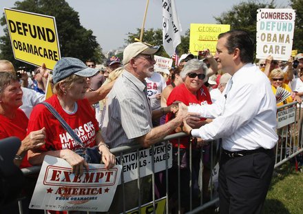U.S. Senator Ted Cruz (R-TX) (R) greets attendees as he arrives to speak at the Tea Party Patriots 'Exempt America from Obamacare' rally on U.S. Senator Ted Cruz (R-TX) (R) greets attendees as he arrives to speak at the Tea Party Patriots 'Exempt America from Obamacare' rally on
