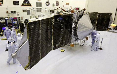 Technicians work on NASA's next Mars-bound spacecraft, the Mars Atmosphere and Volatile Evolution (MAVEN) spacecraft, as it is displayed for Technicians work on NASA's next Mars-bound spacecraft, the Mars Atmosphere and Volatile Evolution (MAVEN) spacecraft, as it is displayed for