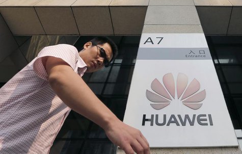 A man walks past a Huawei company logo outside the entrance of a Huawei office in Wuhan, Hubei province, October 9, 2012. REUTERS/Stringer A man walks past a Huawei company logo outside the entrance of a Huawei office in Wuhan, Hubei province, October 9, 2012. REUTERS/Stringer