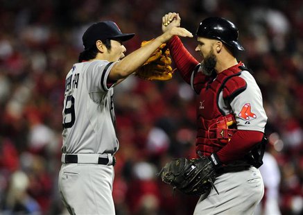 Oct 28, 2013; St. Louis, MO, USA; Boston Red Sox relief pitcher Koji Uehara (19) celebrates with catcher David Ross (rich) after defeating t Oct 28, 2013; St. Louis, MO, USA; Boston Red Sox relief pitcher Koji Uehara (19) celebrates with catcher David Ross (rich) after defeating t