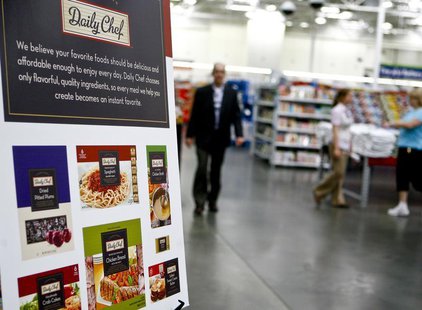 Customers shop next to a sign advertising "Daily Chef," a new proprietary Sam's Club brand, in a Sam's Club store in Bentonville, Arkansas J Customers shop next to a sign advertising "Daily Chef," a new proprietary Sam's Club brand, in a Sam's Club store in Bentonville, Arkansas J