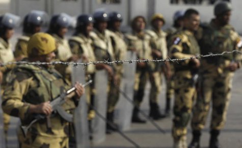Army soldiers take positions as Al-Azhar University student members of the Muslim Brotherhood and supporters of ousted Egyptian President Mo Army soldiers take positions as Al-Azhar University student members of the Muslim Brotherhood and supporters of ousted Egyptian President Mo