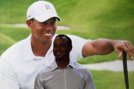 World number one golfer Tiger Woods smiles during a promotional event at the Venetian Macao in Macau October 29, 2013. REUTERS/Bobby Yip World number one golfer Tiger Woods smiles during a promotional event at the Venetian Macao in Macau October 29, 2013. REUTERS/Bobby Yip